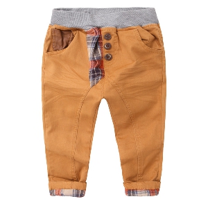 Παιδικά ανοιξηάτικα παντελόνια για αγόρια σε καφέ και πορτοκαλί χρώμα