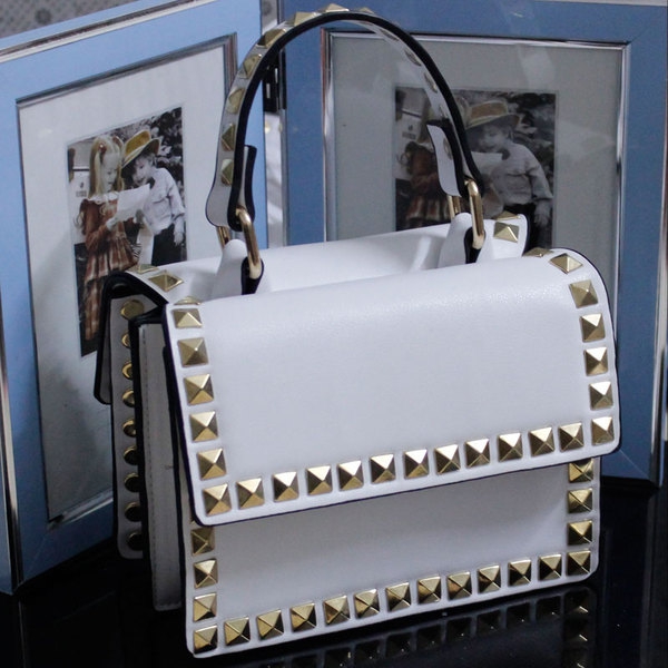 Γυναικεία μικρά συμπαγή τσάντα με καρφιά στο μπροστινό μέρος