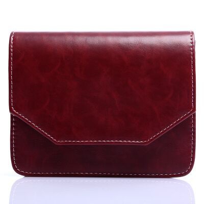 Μια μικρή τσάντα από δέρμα - καφέ, μαύρο, γκρι - κατάλληλο για τον ώμο με μία μαλακή επιφάνεια