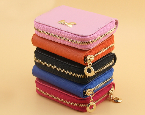 Дамски портфейли от изкуствена кожа в черен,оранжев,цикламен,розов,червен,жълт и син цвят