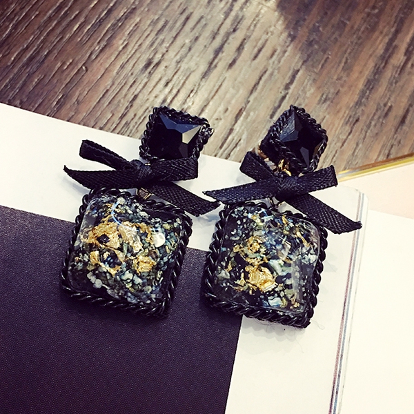 Γυναικέια σκουλαρίκια τύπου κορδέλα