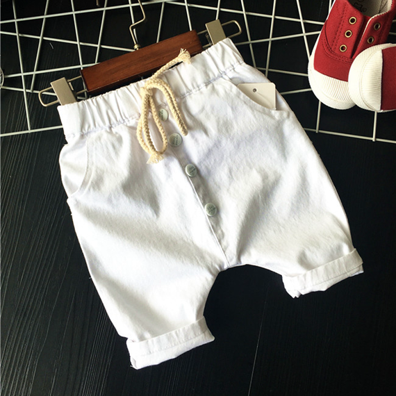 Детски панталони тип потур за момчета в бежов, зелен и бял цвят.