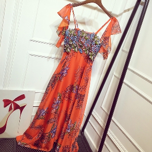 Дамски дълги вечерни рокли с флорални мотиви: оранжеви и розови