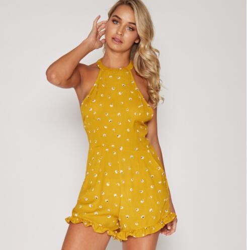 Οι γυναίκες το καλοκαίρι jumpsuit με φυτικά μοτίβα και κόβεται από το πίσω