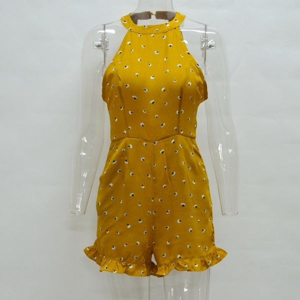 Οι γυναίκες το καλοκαίρι jumpsuit με φυτικά μοτίβα και κόβεται από το πίσω