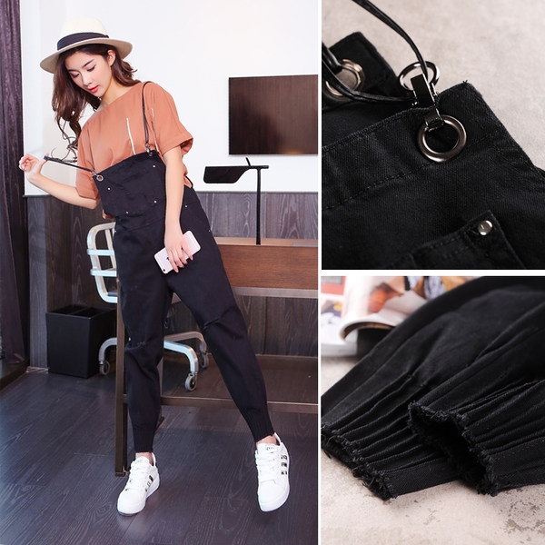 Κομψό κυρίες jumpsuit σε μαύρο και άσπρο σε ένα ευρύ μοντέλο - ασταθής