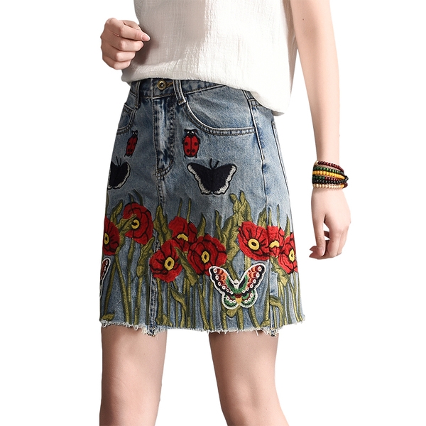 Οι γυναίκες τζιν φούστα με κεντημένα λουλούδια